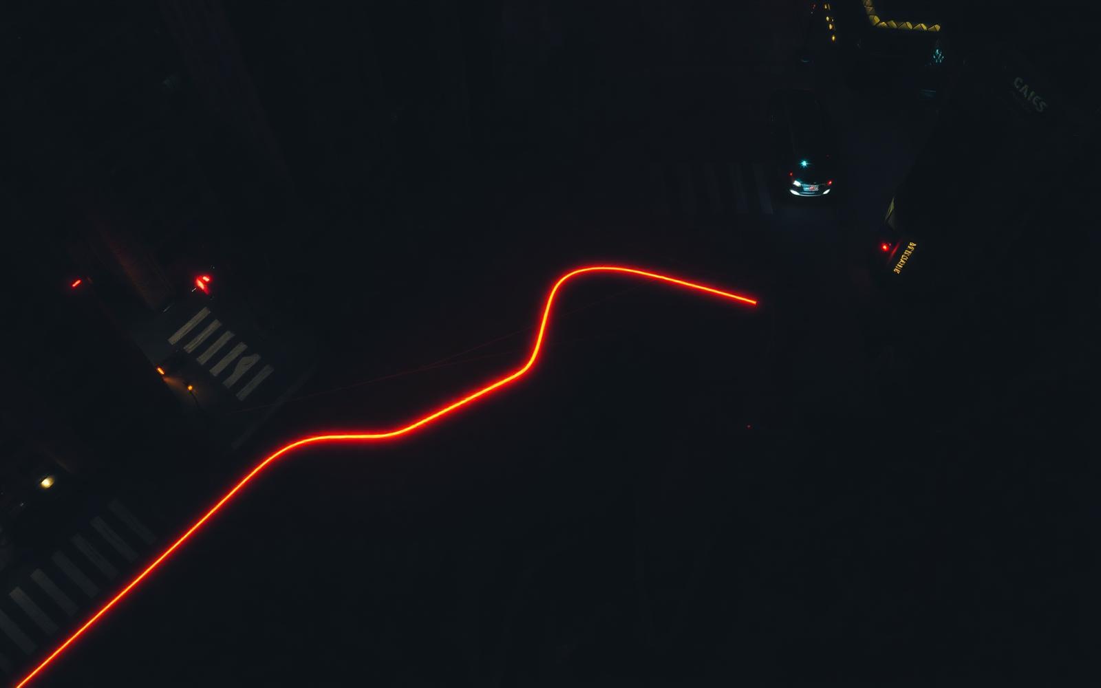 Aerial night street with a glowing tracked route